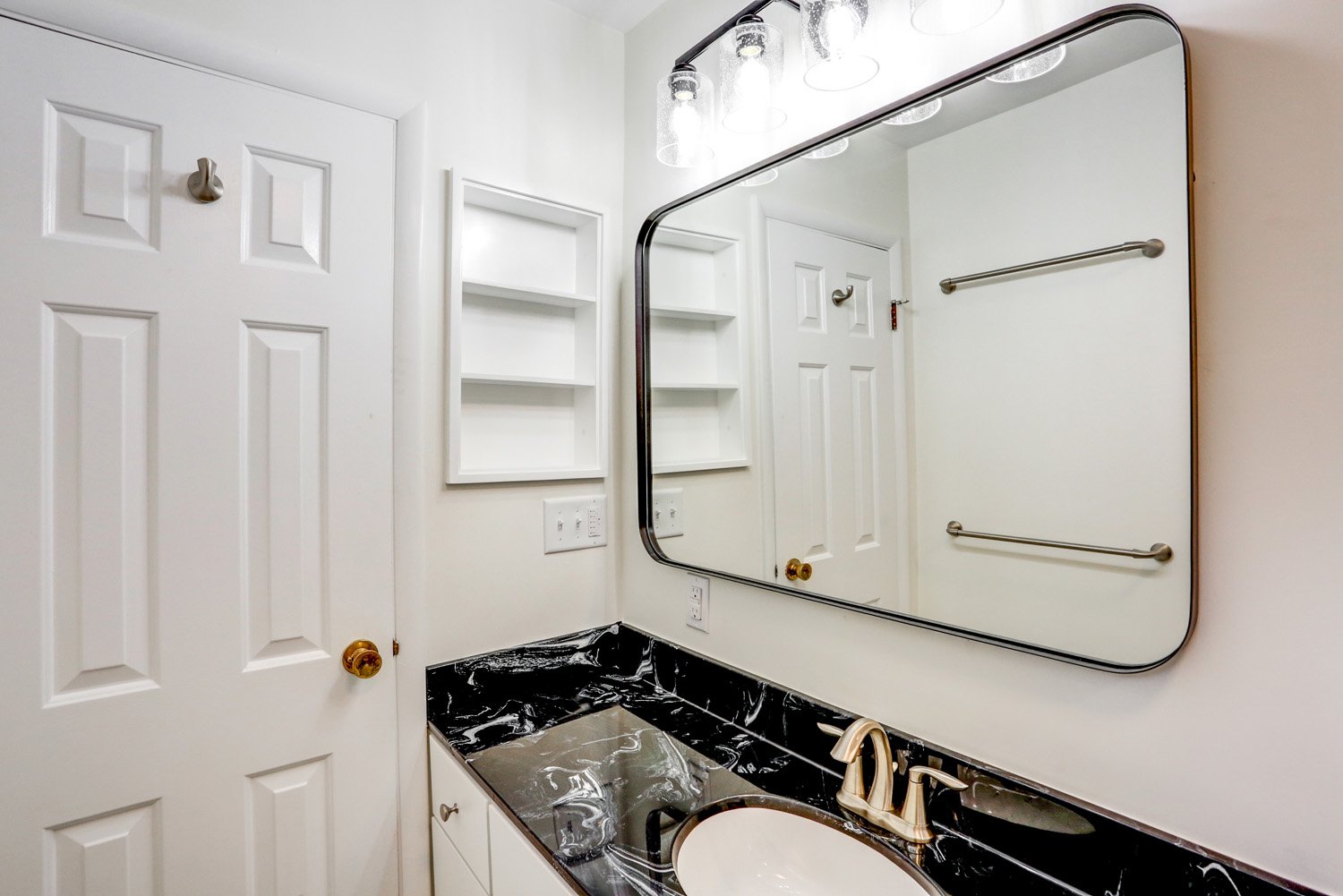 Mirror and light fixtures in Bloomingdale Master Bathroom Remodel