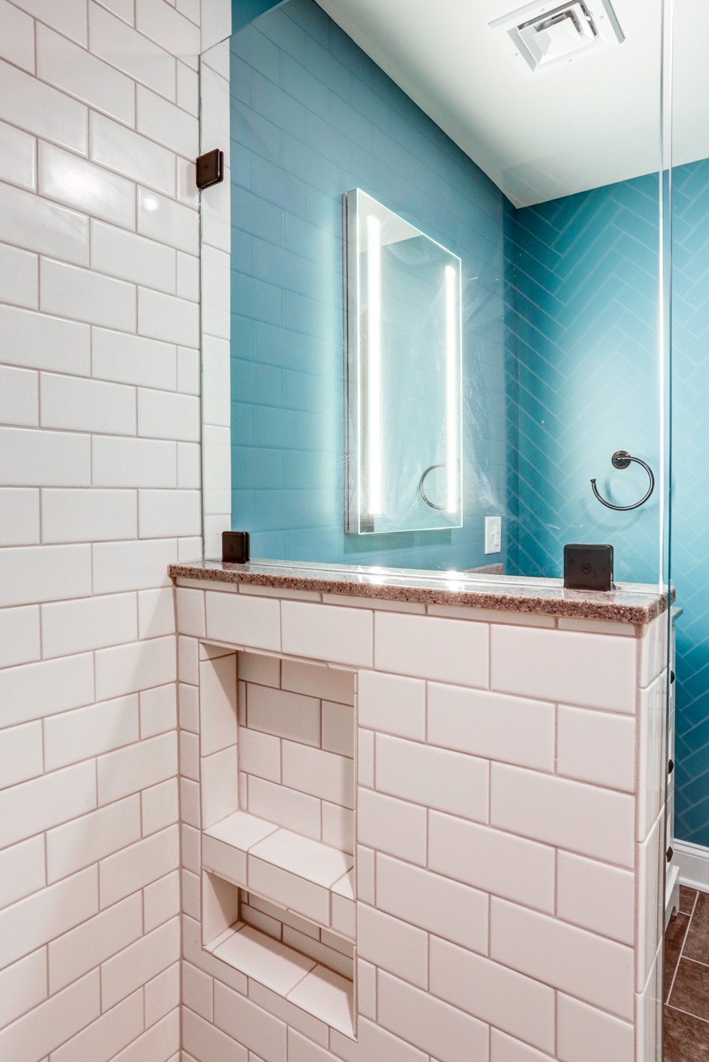 Tile shower with built in shelves in Lititz bathroom basement addition