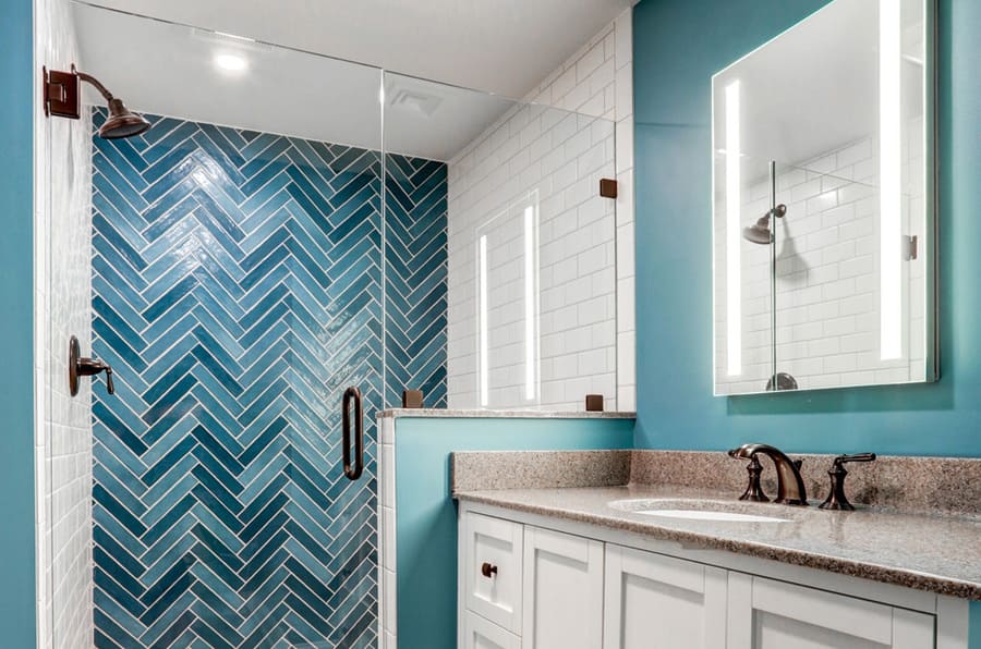 Blue design shower tile and oil rubbed bronze hardware in Lititz basement bathroom