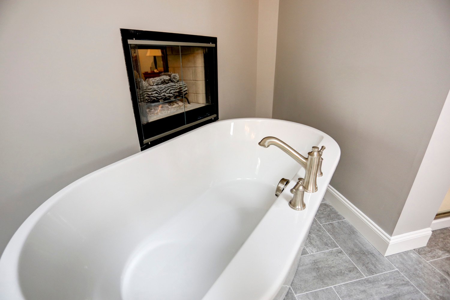 Freestanding tub by fireplace in Manheim Township Master Bathroom Remodel