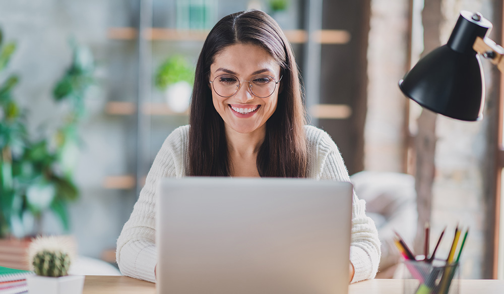 Woman attending a virtual consultation on her laptop